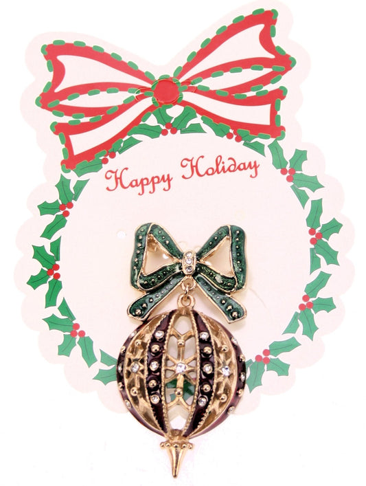 Deze elegante broche in de vorm of een kerstbal voegt direct kerstsfeer toe aan je look. 