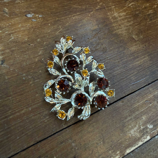 Vintage broche goud – bloem met barnsteenkleurige kristallen